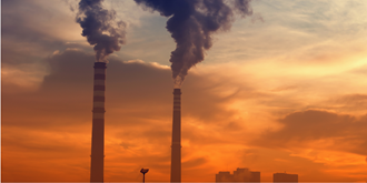 Smoke stacks at sunset